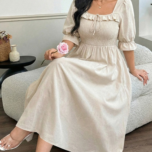 Long Short-sleeved Dress With Bubble Sleeves A Fitted Waist And A Slimming Midi Length