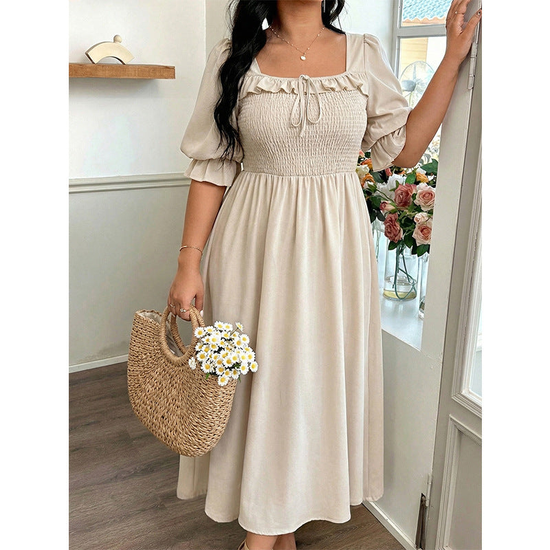 Long Short-sleeved Dress With Bubble Sleeves A Fitted Waist And A Slimming Midi Length