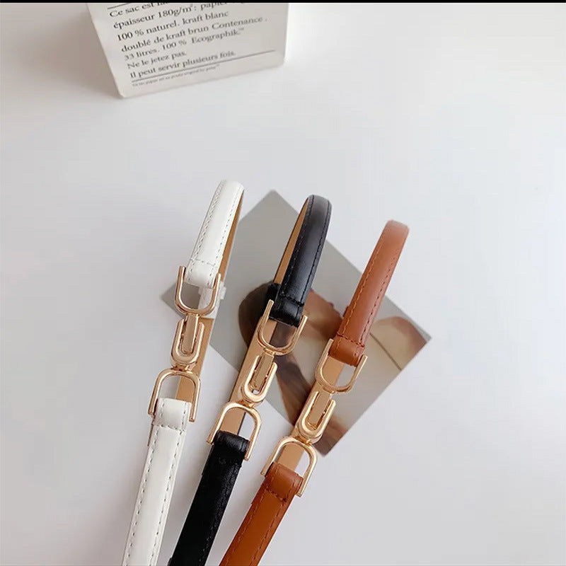 A Pair Of Buckles Belt Womens Fine Decoration Dress Matching in white, black, and brown colors with stylish buckle design.