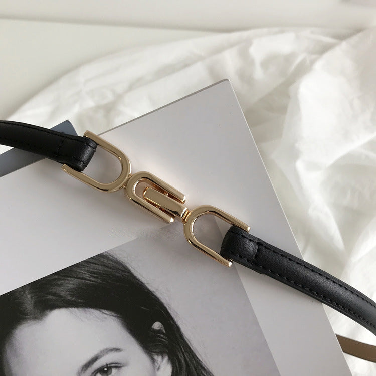 A Pair Of Buckles Belt Womens Fine Decoration Dress Matching with gold alloy buckle on a black imitation leather strap.