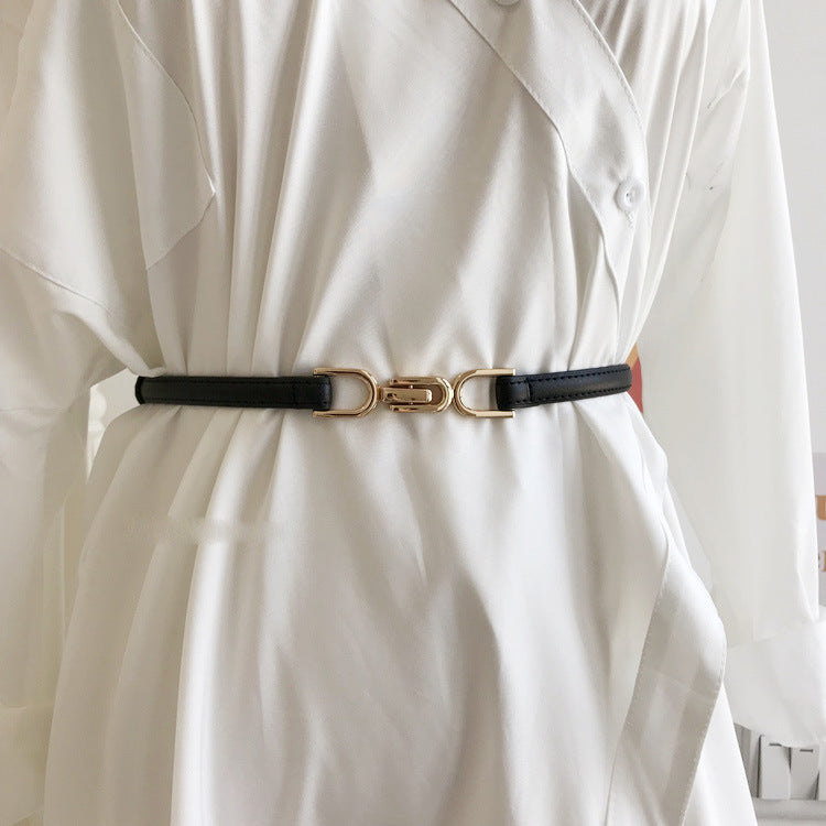 A Pair Of Buckles Belt Womens Fine Decoration Dress Matching worn over a white outfit, featuring a stylish black design.