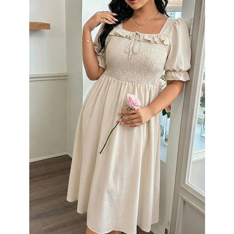 Long Short-sleeved Dress With Bubble Sleeves A Fitted Waist And A Slimming Midi Length