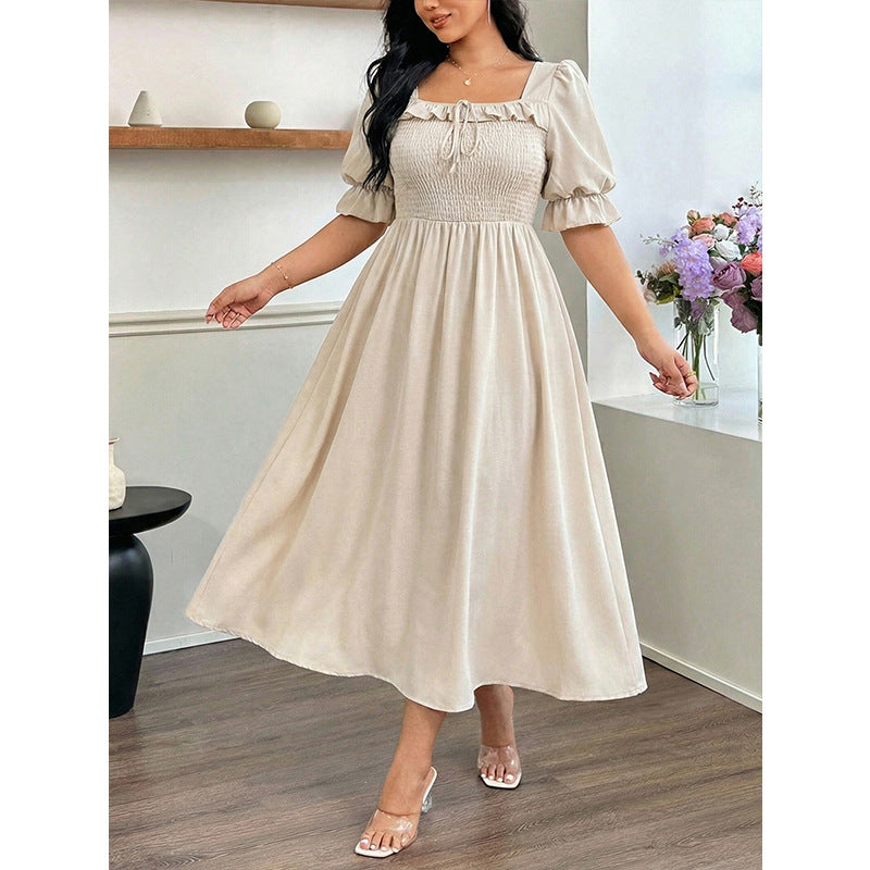 Long Short-sleeved Dress With Bubble Sleeves A Fitted Waist And A Slimming Midi Length
