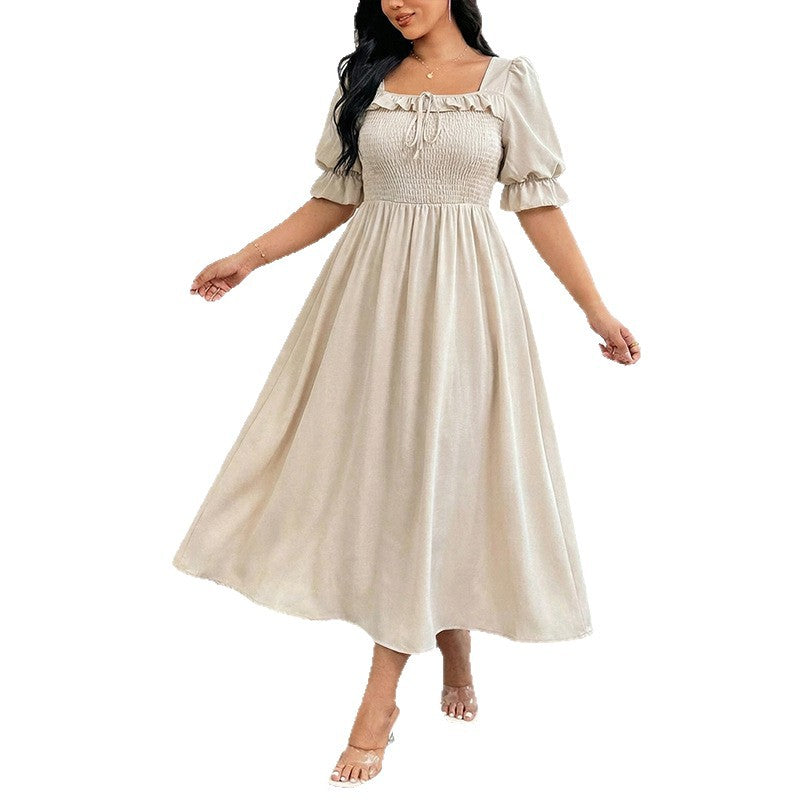 Long Short-sleeved Dress With Bubble Sleeves A Fitted Waist And A Slimming Midi Length